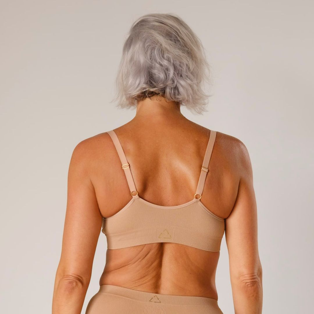 Sustainable, ethically produced Nude 3- light beige skin tone wireless bra by Underwear for Humanity. A -D cup sizes. Recycled materials, flexible, supportive. Knitted bra and band, adjustable straps. Models wear the A-D bra.