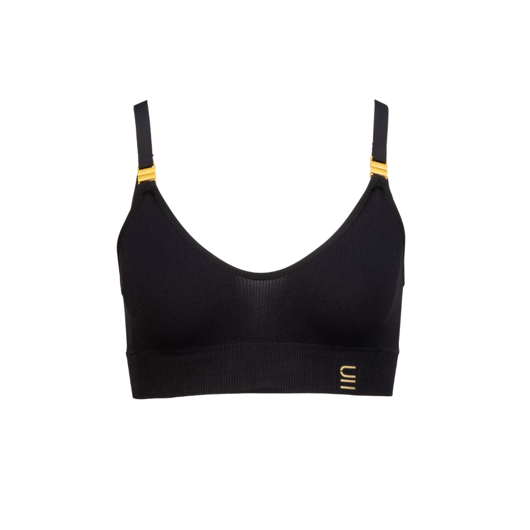 Sustainable Black wireless bra by Underwear For Humanity: ethical, sustainable. A -D cup sizes. Recycled materials, flexible, supportive. Knitted bra and band, adjustable straps. Model wears A-D bra