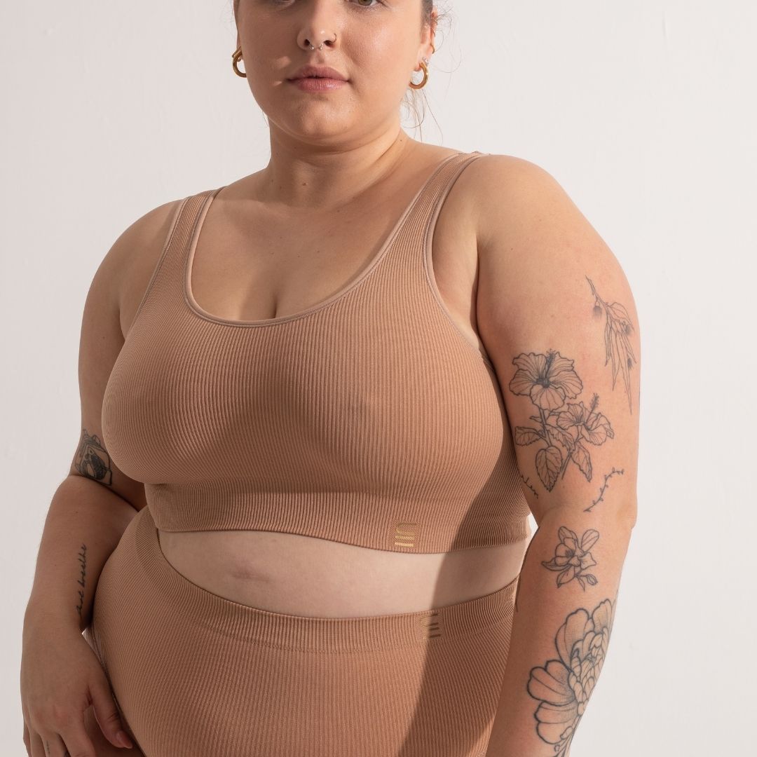 Sustainable, ethically produced nude 3- light beige skin tone bra crop by Underwear for Humanity: stronger support for larger bust, D - GG cup sizes. Recycled materials, knitted bra and band, seamfree, made from recycled nylon. Models wear the D+ Crop