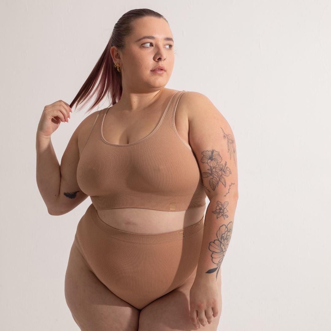 Sustainable, ethically produced nude 3- light beige skin tone bra crop by Underwear for Humanity: stronger support for larger bust, D - GG cup sizes. Recycled materials, knitted bra and band, seamfree, made from recycled nylon. Models wear the D+ Crop