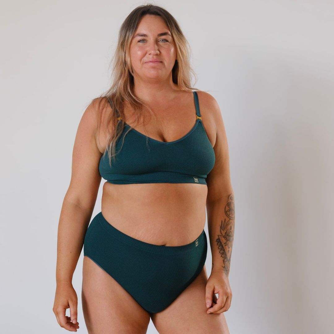 Sustainable, ethically made Atlantis high waist seam free brief by Underwear for Humanity: Flexible and comfortable, stretches across sizes. Models wear high waisted ethical underwear. Underwear is made from recycled nylon and sits high on the waist, full seat coverage and smooth on the body.