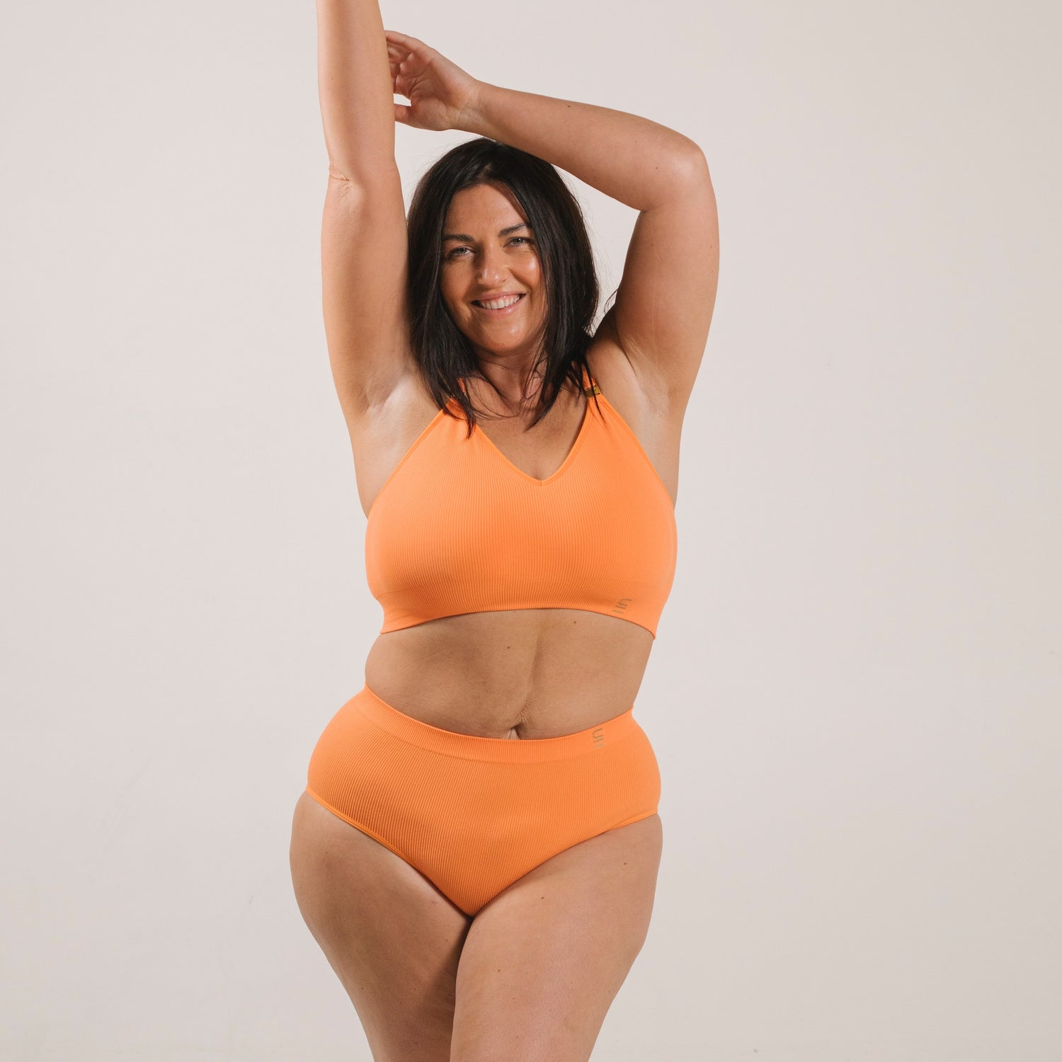 Sustainable, ethically produced mandarin wireless bra by Underwear for Humanity. A -D cup sizes. Recycled materials, flexible, supportive. Knitted bra and band, adjustable straps. Models wear the A-D bra.
