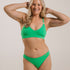 Ethically made recycled seam free apple bikini brief by Underwear for Humanity: Flexible and comfortable, stretches across sizes. Models wear bikini brief underwear. Underwear is made from recycled nylon and sits low on the waist, full seat coverage and smooth on the body.
