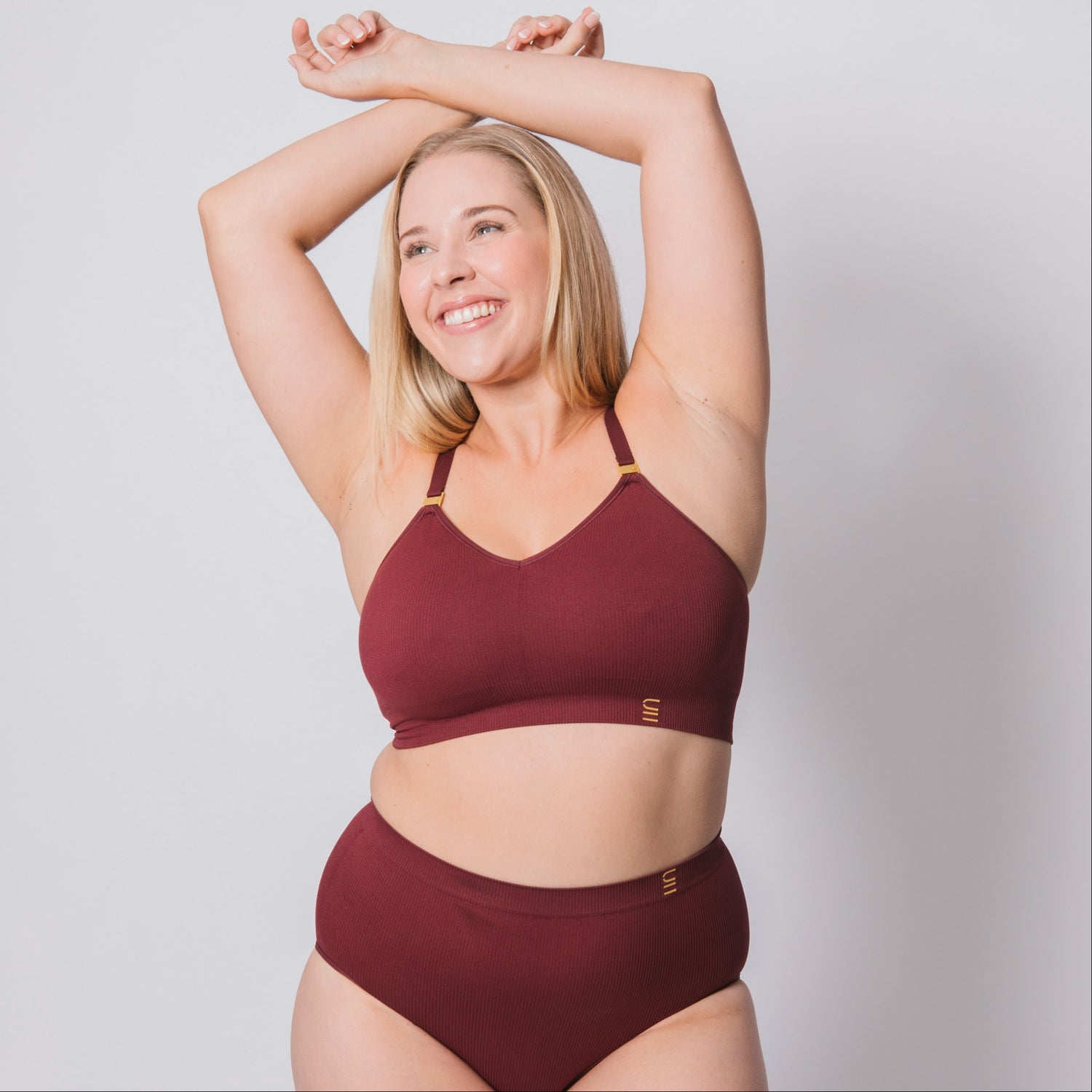 Sustainable, ethically produced Cranberry wireless bra by Underwear for Humanity. For DD-GG cup sizes. Recycled materials, flexible, supportive. Knitted bra and band, adjustable straps. Model wears the DD+ bra.