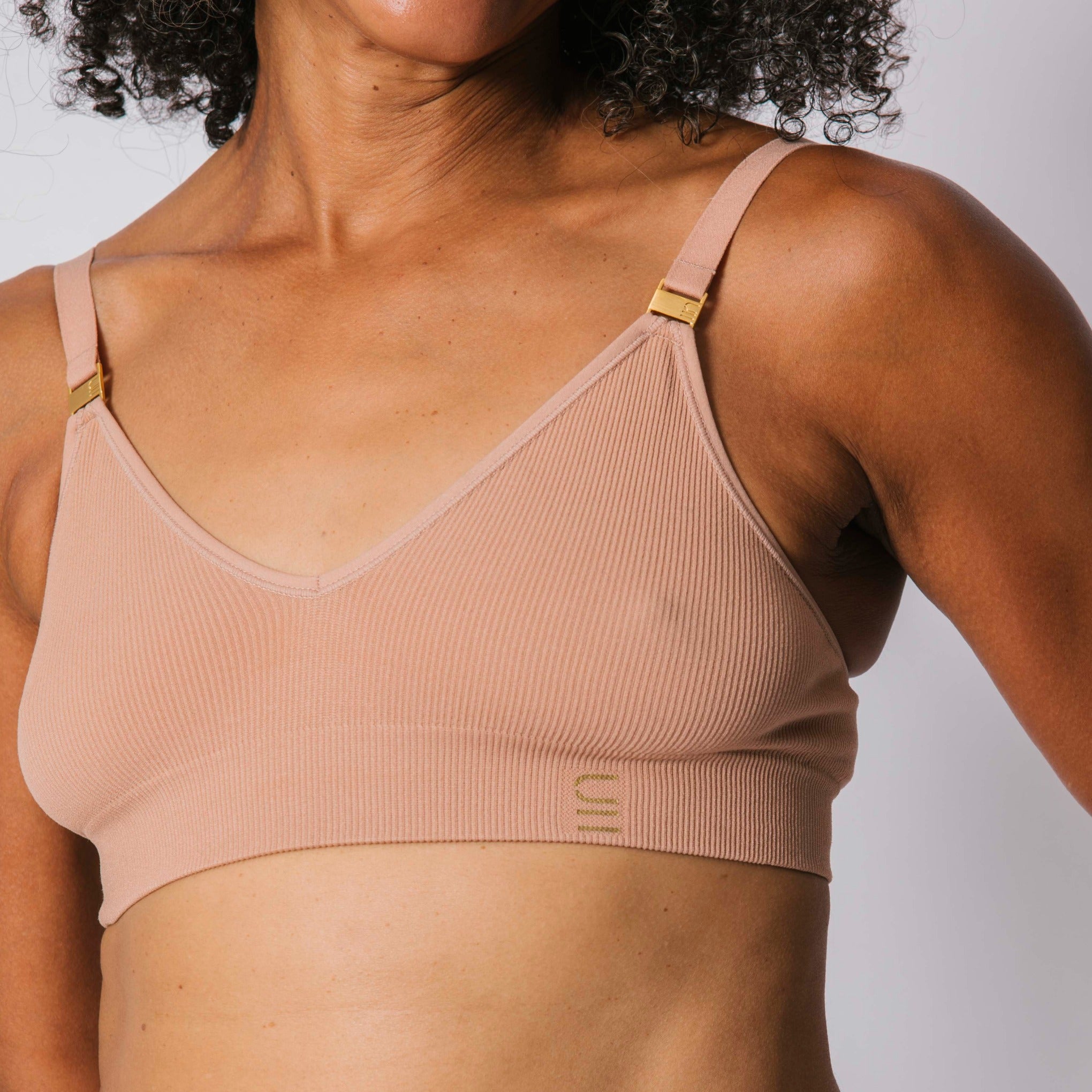 Sustainable, ethically produced Nude 3- light beige skin tone wireless bra by Underwear for Humanity. A -D cup sizes. Recycled materials, flexible, supportive. Knitted bra and band, adjustable straps. Models wear the A-D bra.