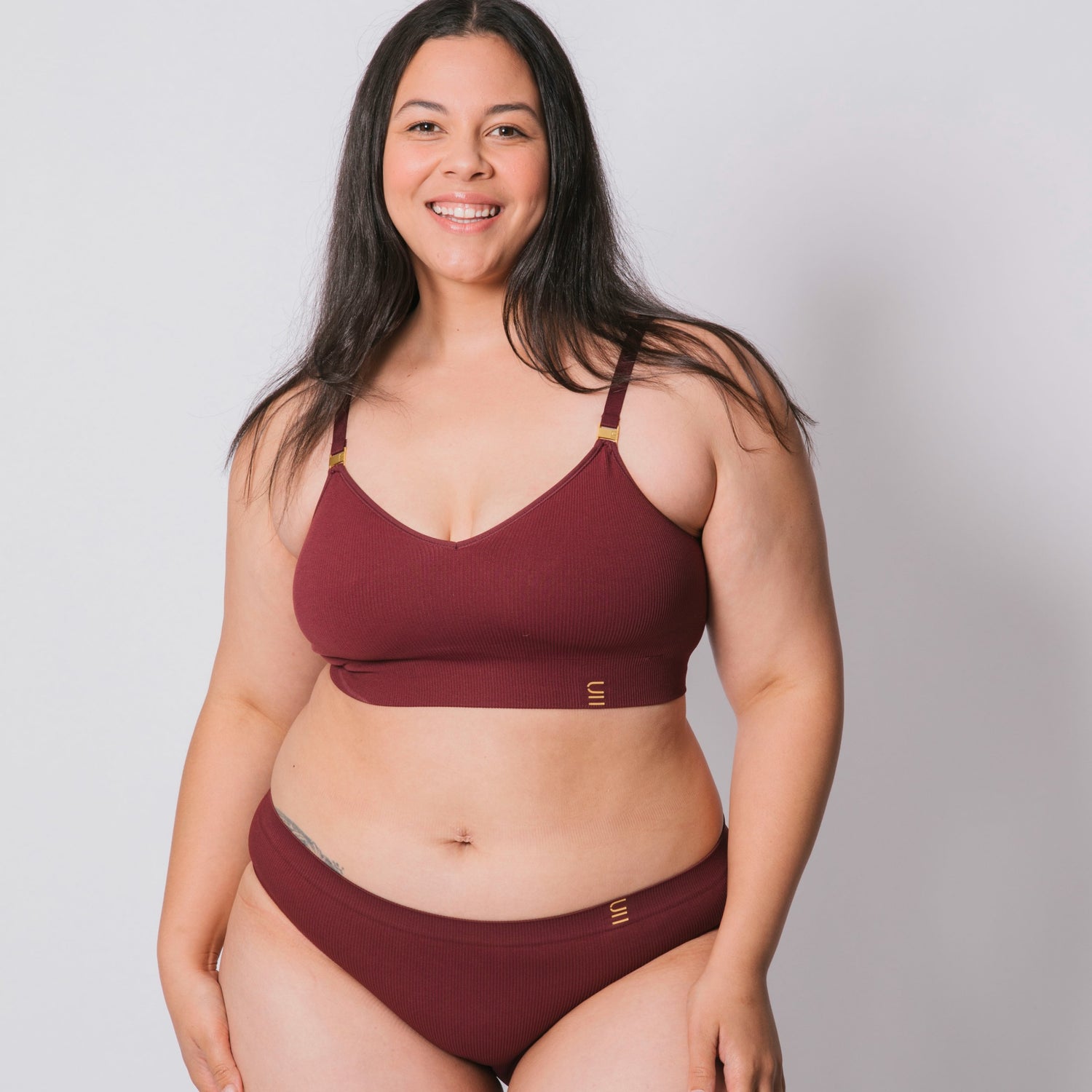 Sustainable, ethically made Cranberry high waist seam free brief by Underwear for Humanity: Flexible and comfortable, stretches across sizes. Models wear high waisted ethical underwear. Underwear is made from recycled nylon and sits high on the waist, full seat coverage and smooth on the body.