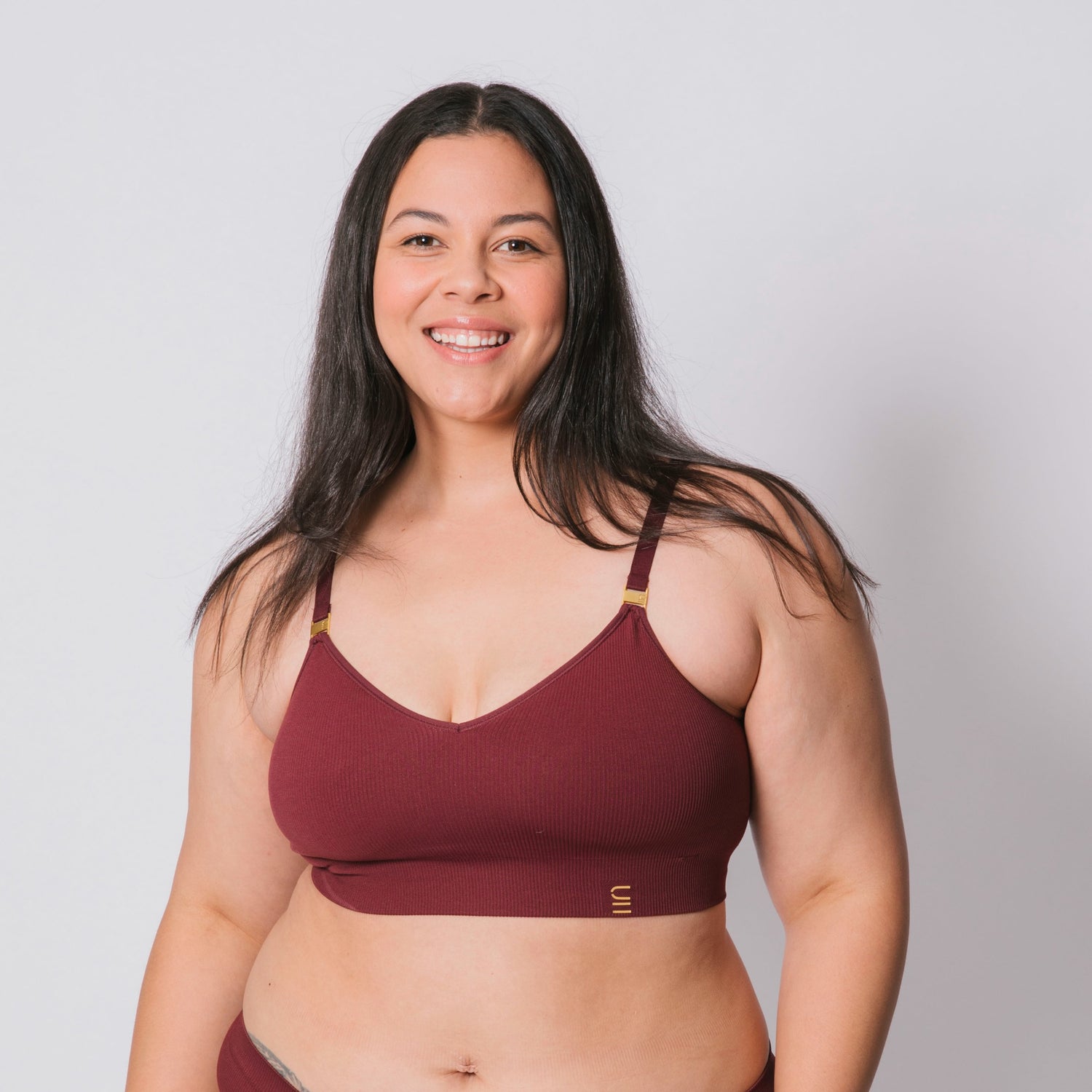 Sustainable, ethically produced Cranberry wireless bra by Underwear for Humanity. For DD-GG cup sizes. Recycled materials, flexible, supportive. Knitted bra and band, adjustable straps. Model wears the DD+ bra.