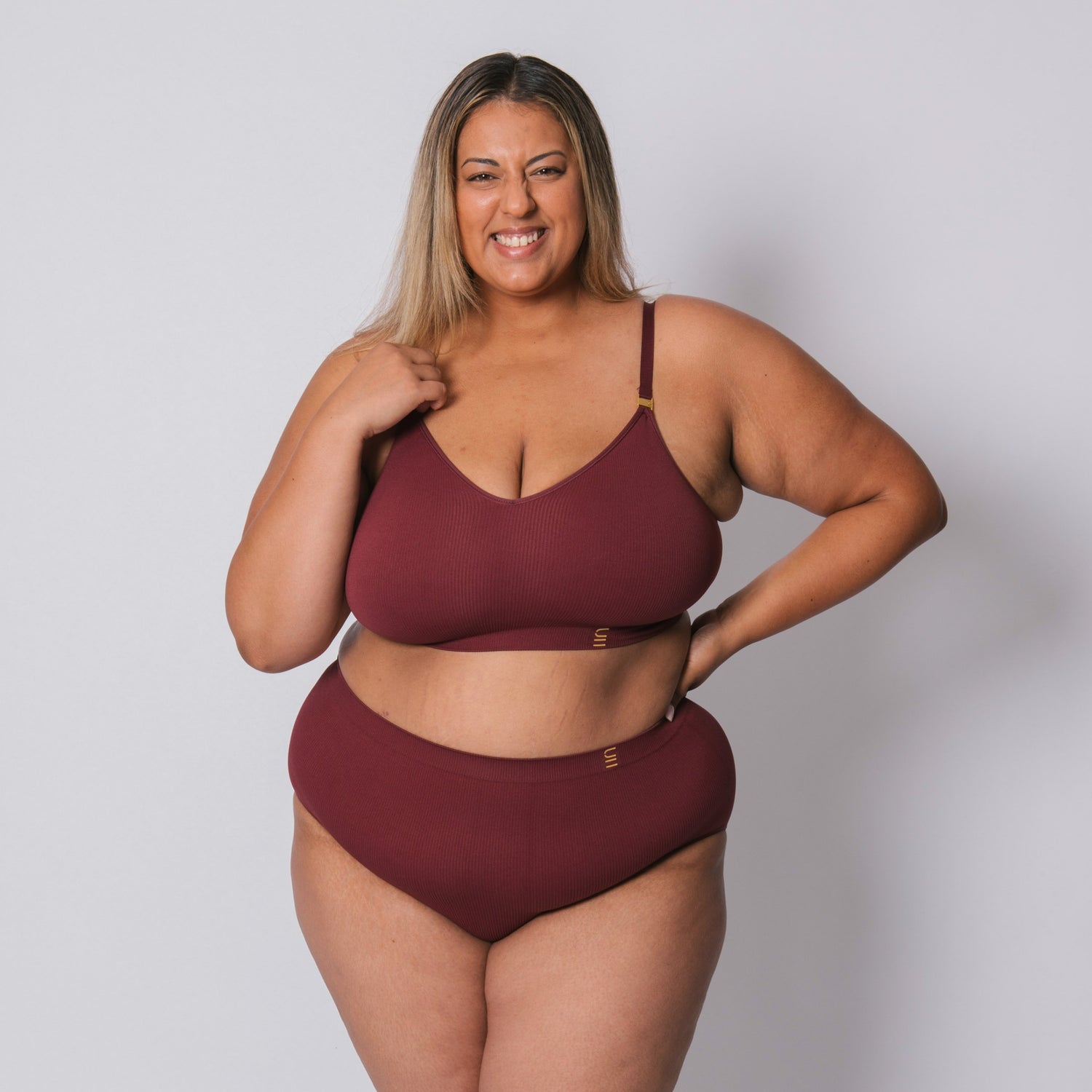 Sustainable, ethically made Cranberry high waist seam free brief by Underwear for Humanity: Flexible and comfortable, stretches across sizes. Models wear high waisted ethical underwear. Underwear is made from recycled nylon and sits high on the waist, full seat coverage and smooth on the body.