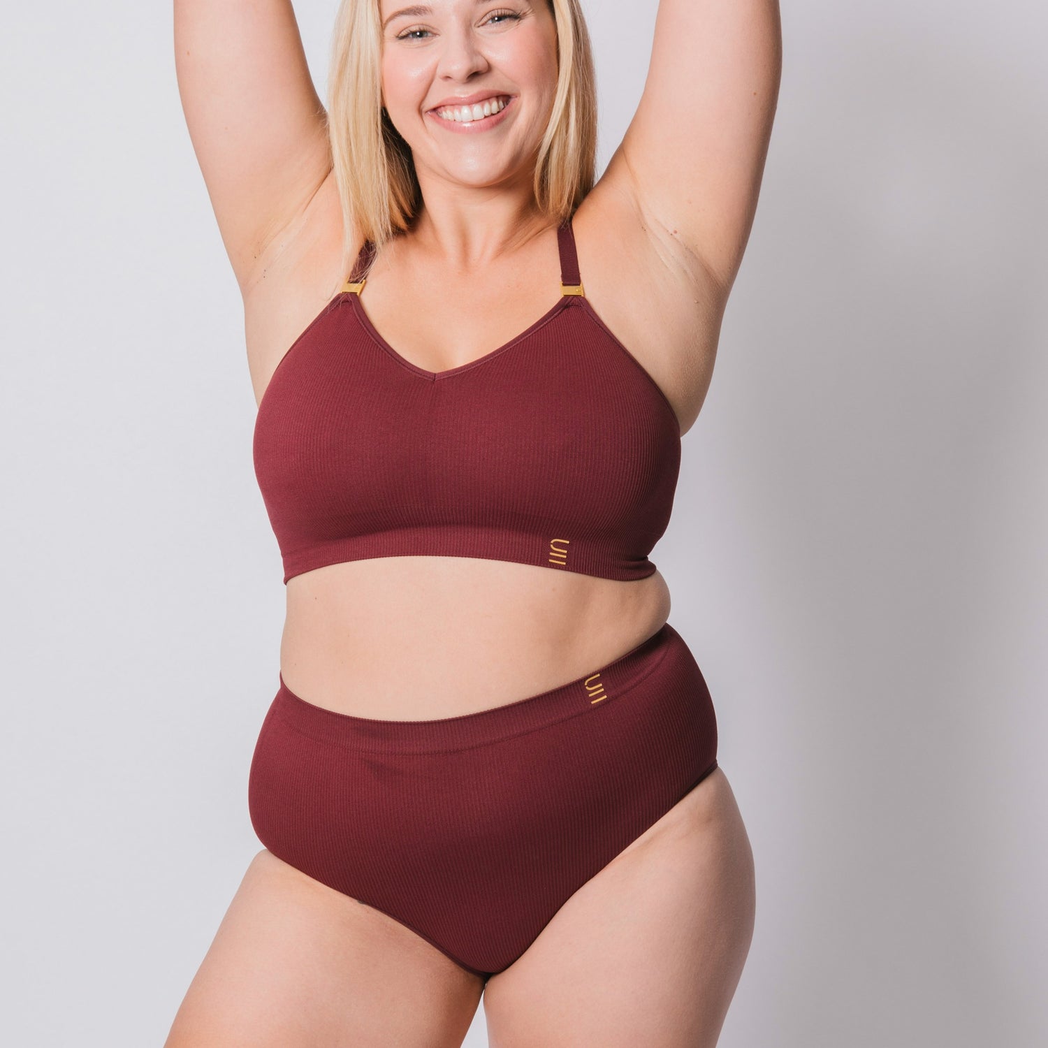 Sustainable, ethically made Cranberry high waist seam free brief by Underwear for Humanity: Flexible and comfortable, stretches across sizes. Models wear high waisted ethical underwear. Underwear is made from recycled nylon and sits high on the waist, full seat coverage and smooth on the body.
