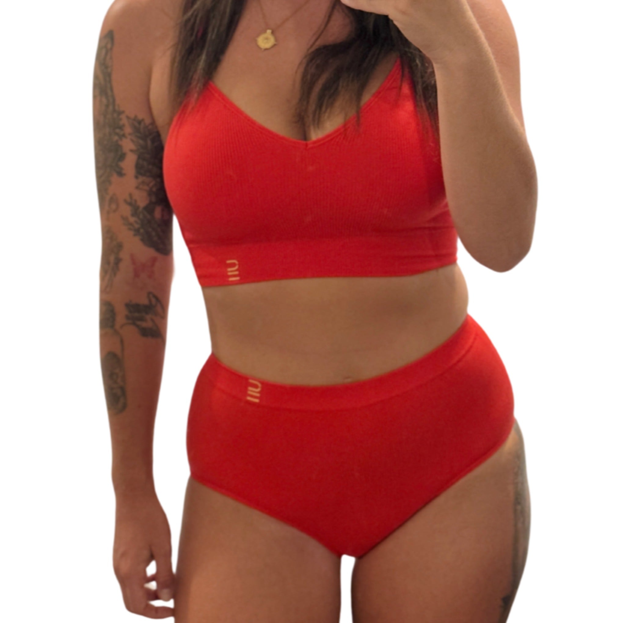 Sustainable red high waist brief by Underwear for Humanity: ethical, sustainable. sizes 6-30 light, breathable. Models wear high-waisted underwear. underwear sits high on the waist, full seat coverage. smooth under clothing. made from Tencel and recycled materials, attached no-dig recycled elastic waist band.