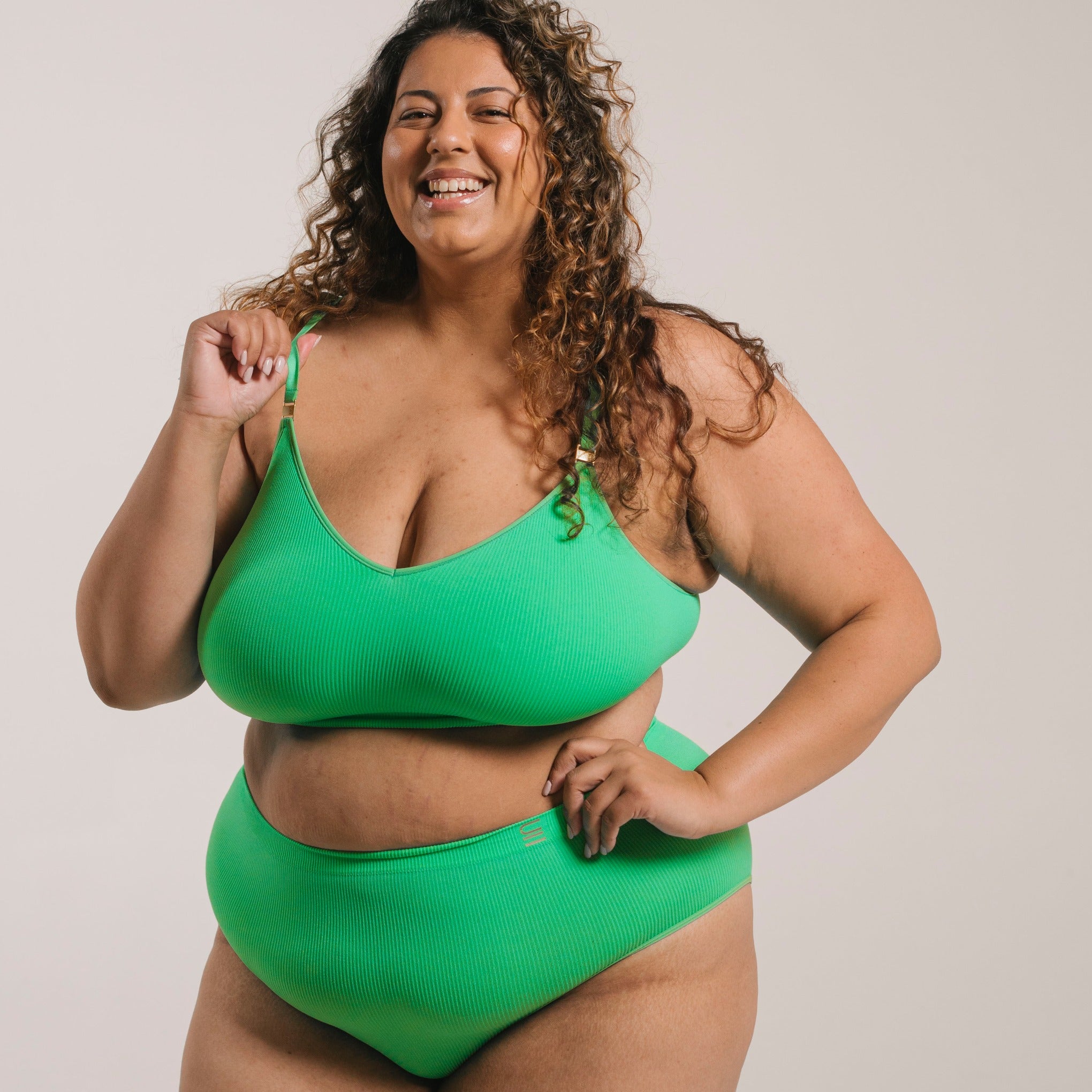 Sustainable, ethically made apple high waist seam free brief by Underwear for Humanity: Flexible and comfortable, stretches across sizes. Models wear high waisted ethical underwear. Underwear is made from recycled nylon and sits high on the waist, full seat coverage and smooth on the body.