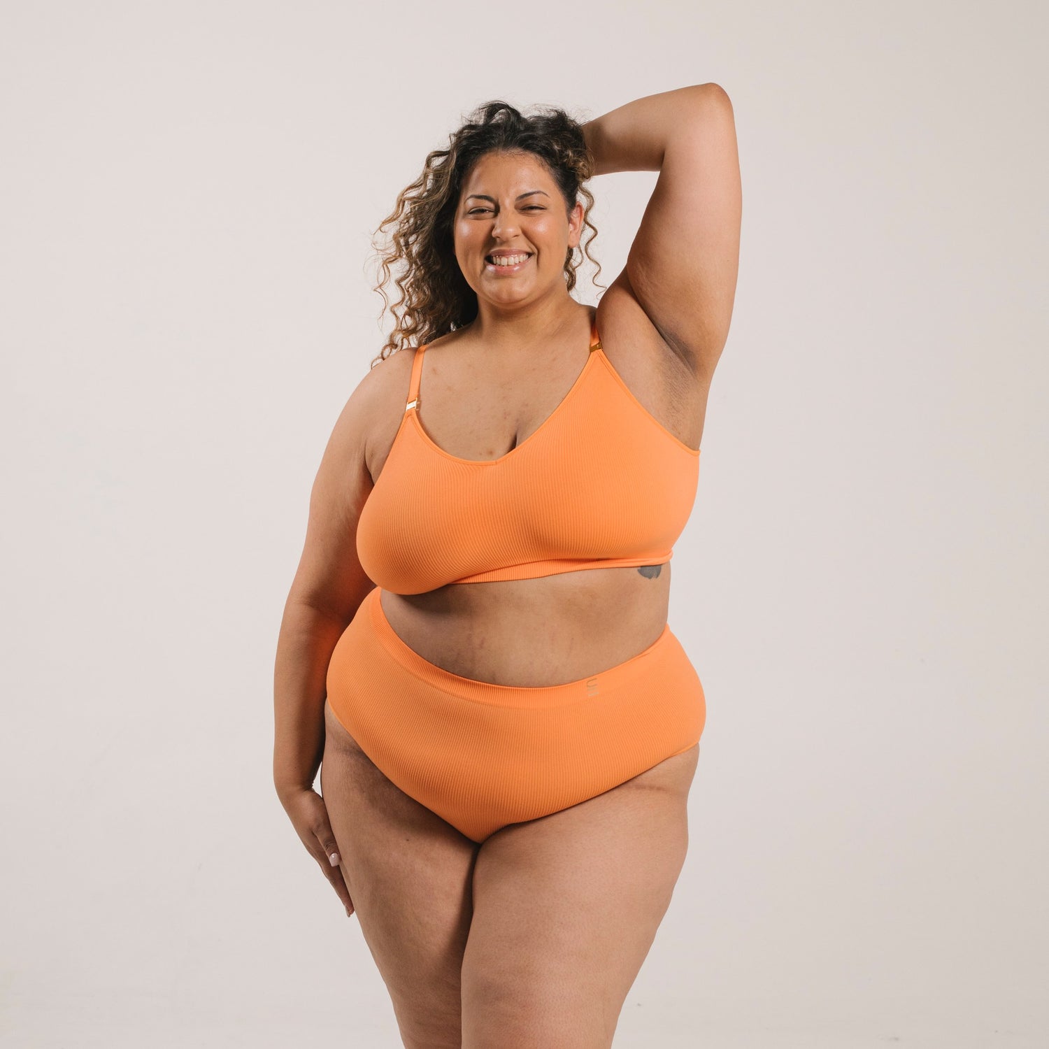 Sustainable, ethically produced mandarin wireless bra by Underwear for Humanity. A -D cup sizes. Recycled materials, flexible, supportive. Knitted bra and band, adjustable straps. Models wear the A-D bra.