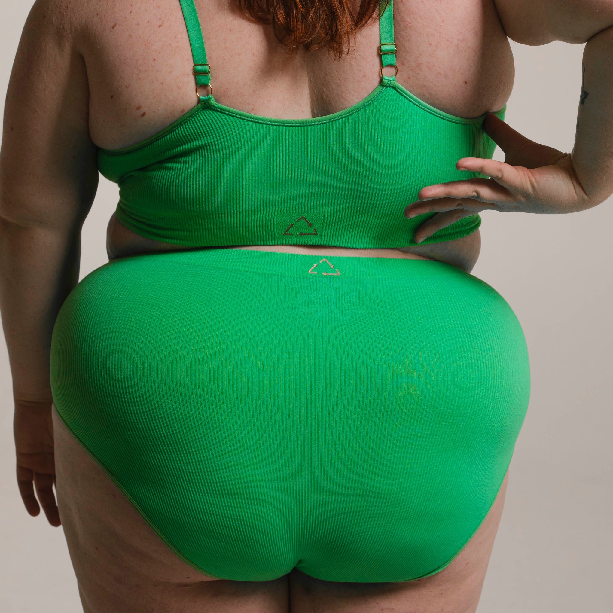 Sustainable, ethically made apple high waist seam free brief by Underwear for Humanity: Flexible and comfortable, stretches across sizes. Models wear high waisted ethical underwear. Underwear is made from recycled nylon and sits high on the waist, full seat coverage and smooth on the body.