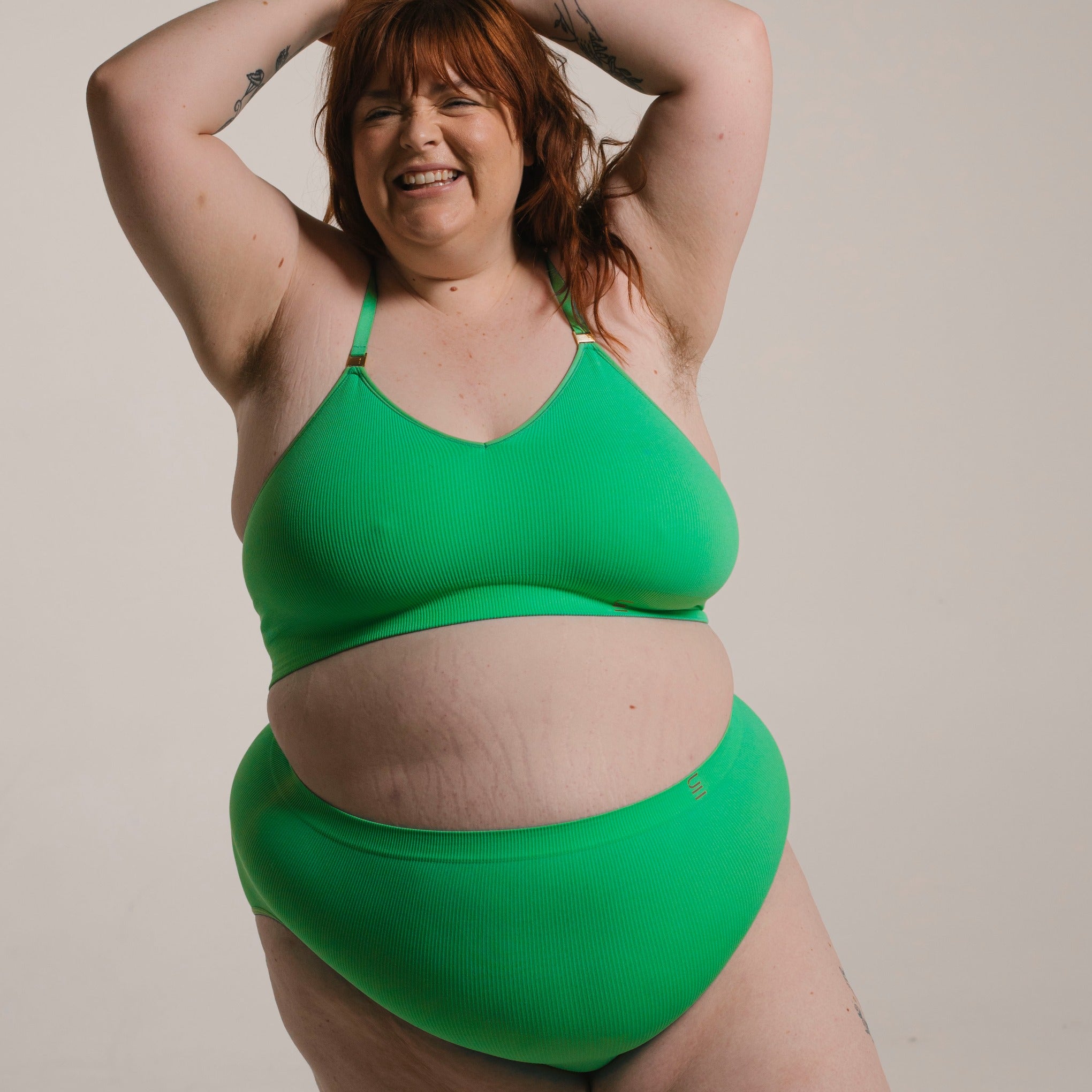 Sustainable, ethically made apple high waist seam free brief by Underwear for Humanity: Flexible and comfortable, stretches across sizes. Models wear high waisted ethical underwear. Underwear is made from recycled nylon and sits high on the waist, full seat coverage and smooth on the body.