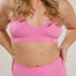 Sustainable, ethically produced pink wireless bra by Underwear for Humanity. A -D cup sizes. Recycled materials, flexible, supportive. Knitted bra and band, adjustable straps. Models wear the A-D bra.