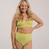 Sustainable, ethically made Lime high waist seam free brief by Underwear for Humanity: Flexible and comfortable, stretches across sizes. Models wear high waisted ethical underwear. Underwear is made from recycled nylon and sits high on the waist, full seat coverage and smooth on the body.