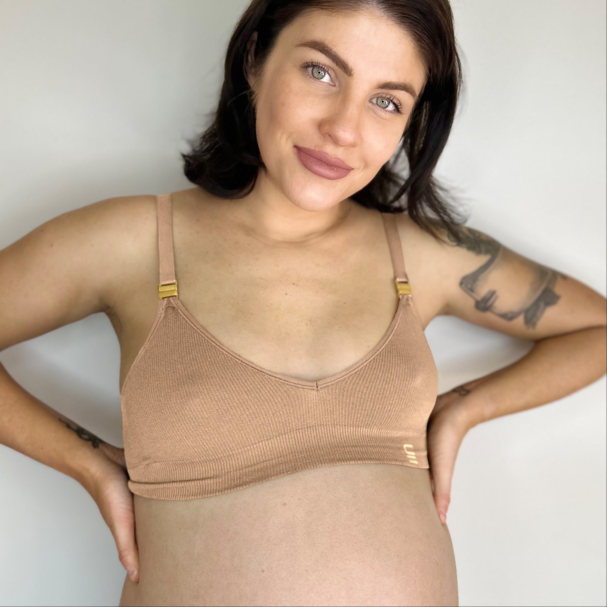 Sustainable, ethically made, atlantis wireless maternity bra by Underwear For Humanity. A -D and DD-GG cup sizes. Recycled materials, flexible, supportive, pregnancy, feeding, convertible. Knitted bra and band, adjustable straps. Model wears maternity bra