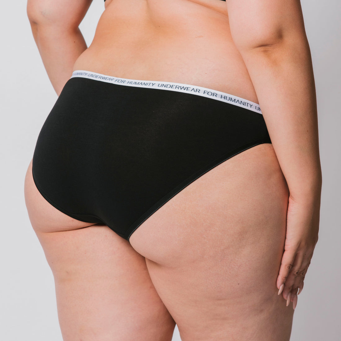 Organic cotton bikini briefs in black – eco-friendly and sustainable underwear.