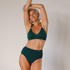 Sustainable, ethically made Atlantis high waist seam free brief by Underwear for Humanity: Flexible and comfortable, stretches across sizes. Models wear high waisted ethical underwear. Underwear is made from recycled nylon and sits high on the waist, full seat coverage and smooth on the body.