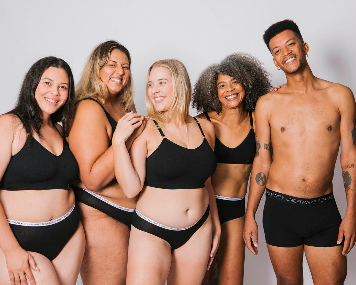 Three models wearing black underwear