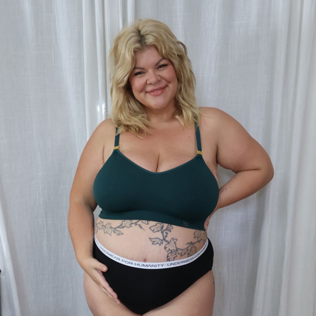 Sustainable, ethically made, atlantis wireless maternity bra by Underwear For Humanity. A -D and DD-GG cup sizes. Recycled materials, flexible, supportive, pregnancy, feeding, convertible. Knitted bra and band, adjustable straps. Model wears maternity bra