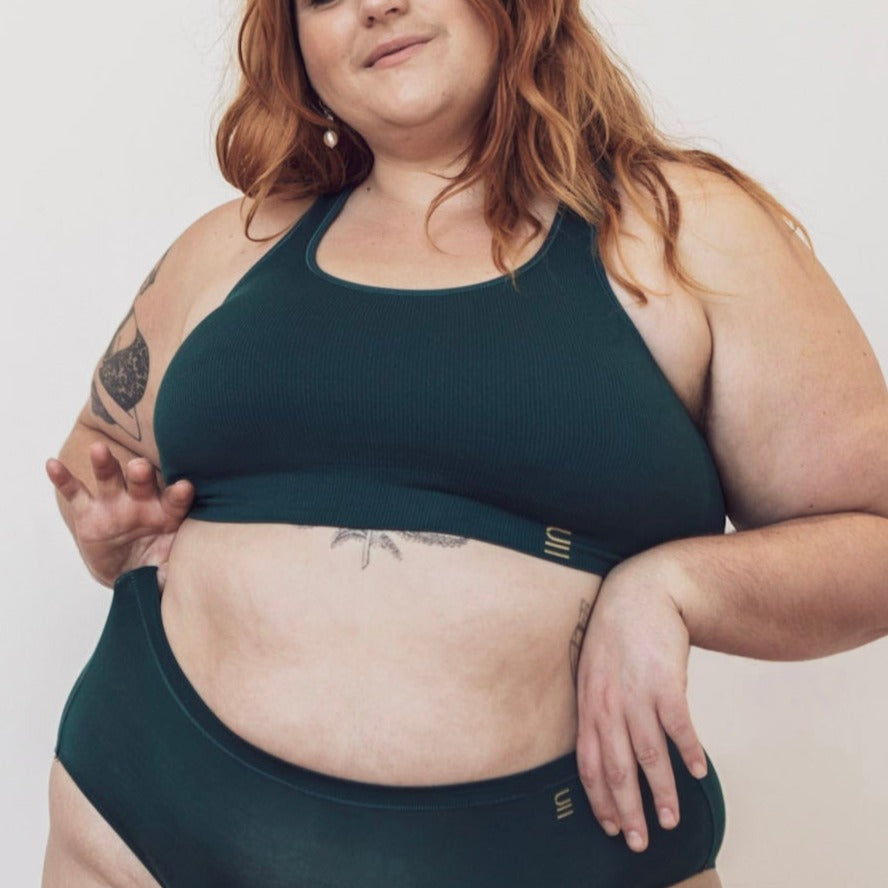 Sustainable, ethically produced atlantis bra crop by Underwear for Humanity: stronger support for larger bust, D - GG cup sizes. Recycled materials, knitted bra and band, seamfree, made from recycled nylon. Models wear the D+ Crop
