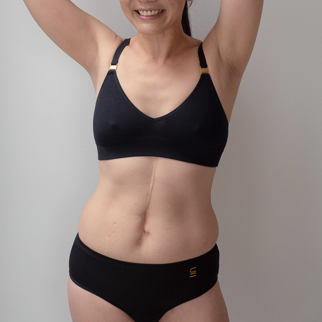 Sustainable, ethically made black wee or period undies. Absorbent without bulk. 1 day worth of wear or 3 tampons worth of protection. Suitable for day time use only. Toxin free, naturally antibacterial. Model wears daytime wee or period undies.