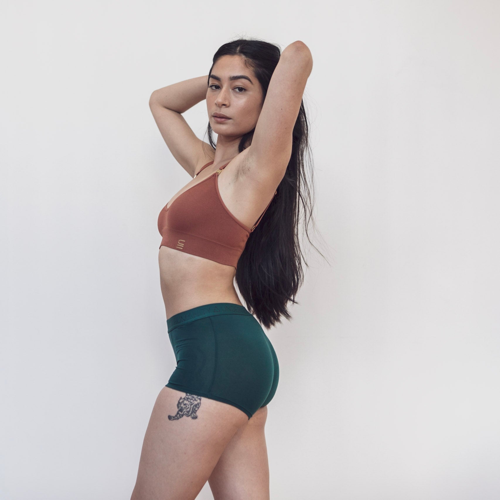 Sustainable, ethically produced atlantis shorts by Underwear for Humanity. Mid-rise, full coverage seat, thin, no-dig, elastic waist, short length sits higher on the leg. Made from sustainable tencel and recycled elastic. Models wear the shorts.