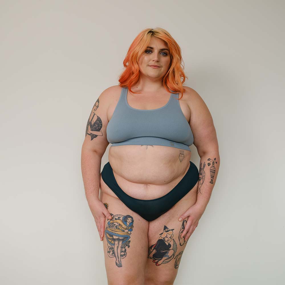 Sustainable atlantis high waist g-string by Underwear for Humanity: ethical, sustainable. sizes 6-26. Models wear high-waisted G -string underwear. underwear sits high on the waist, sits smooth on the body, made from Tencel and recycled materials.