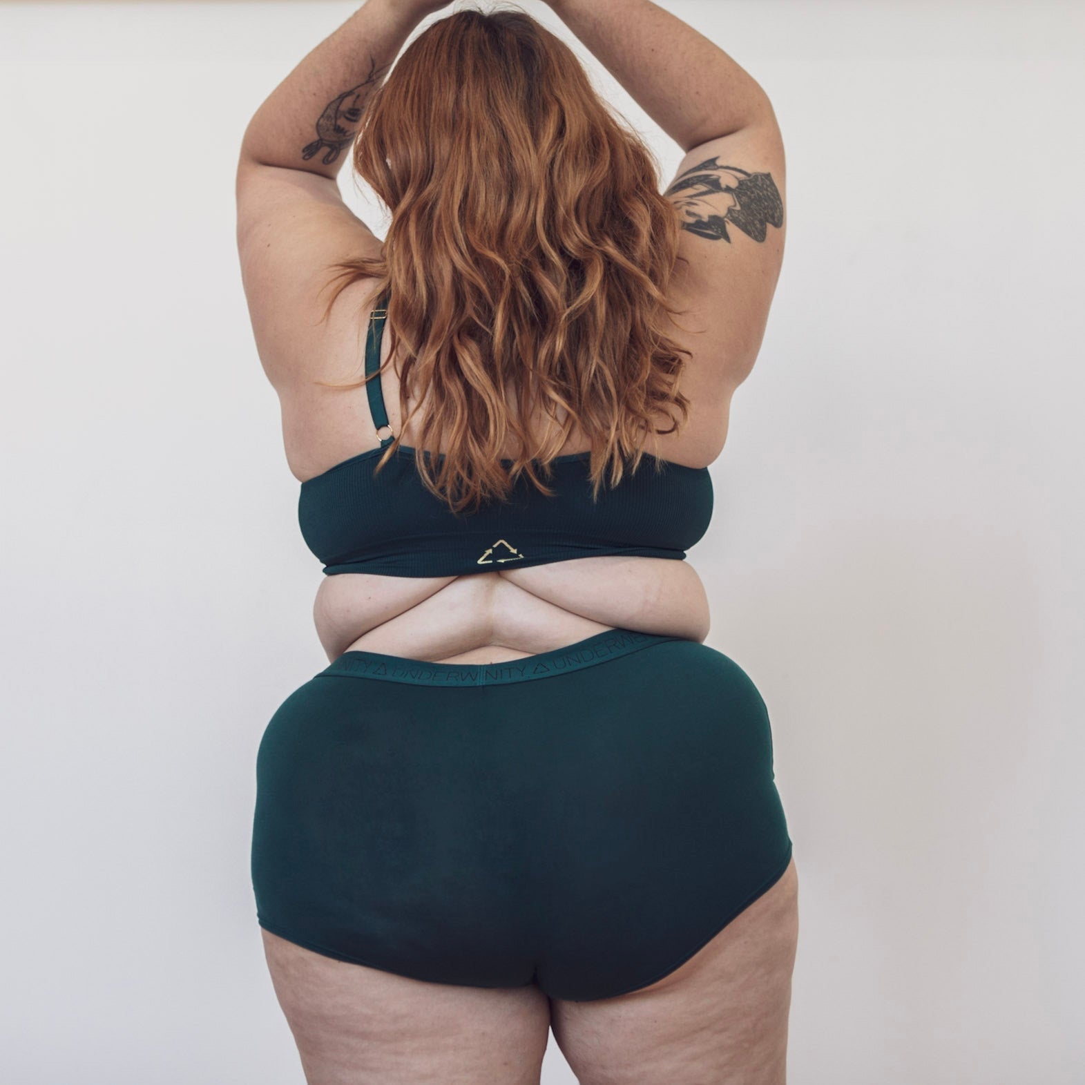 Sustainable, ethically produced atlantis shorts by Underwear for Humanity. Mid-rise, full coverage seat, thin, no-dig, elastic waist, short length sits higher on the leg. Made from sustainable tencel and recycled elastic. Models wear the shorts.