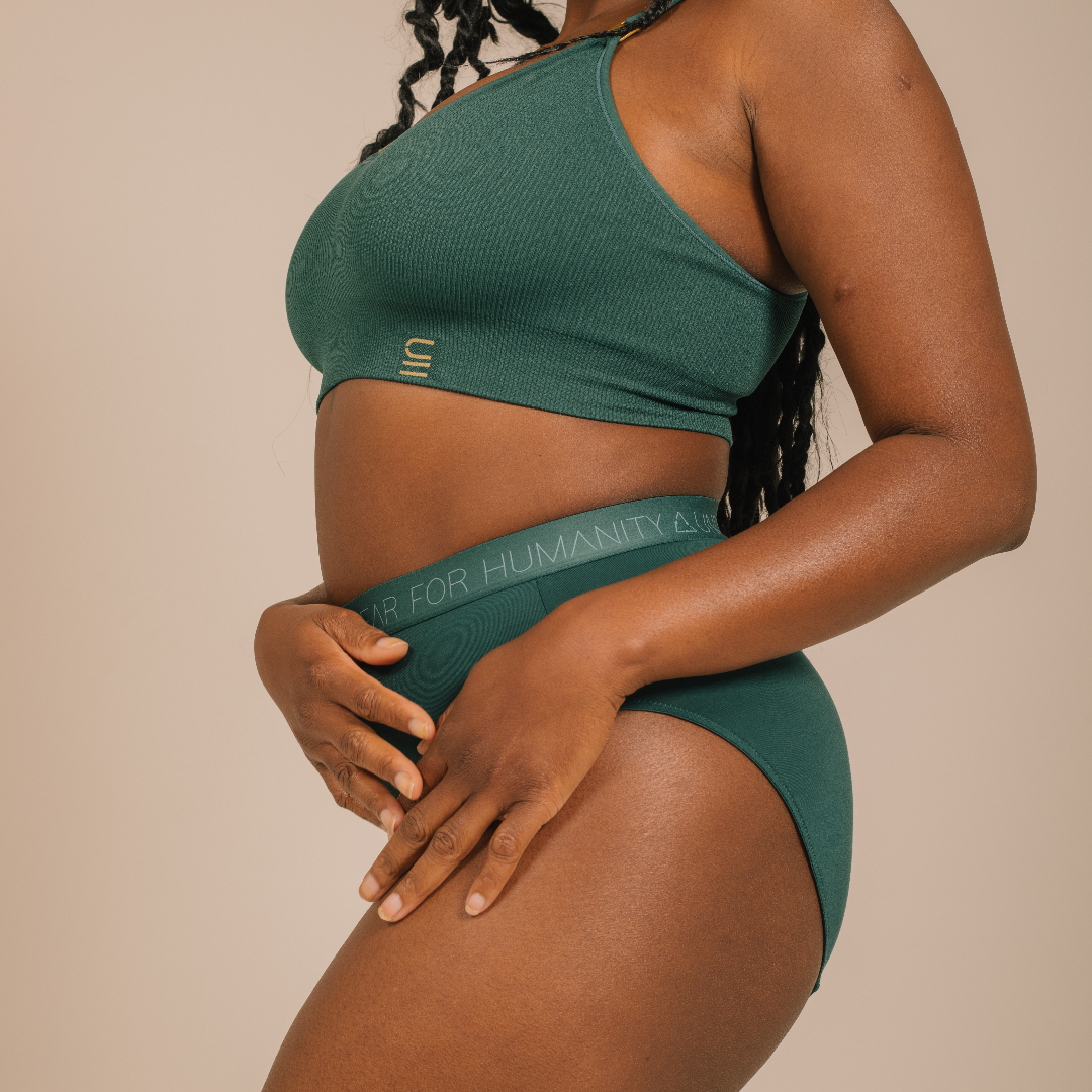 Sustainable atlantis high waist brief by Underwear for Humanity: ethical, sustainable. sizes 6-30 light, breathable. Models wear high-waisted underwear. underwear sits high on the waist, full seat coverage. smooth under clothing. made from Tencel and recycled materials, attached no-dig recycled elastic waist band.