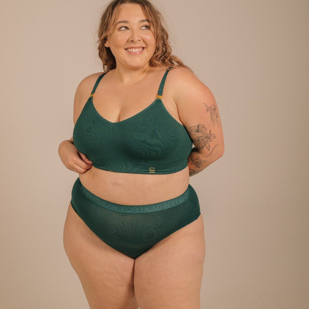 Sustainable atlantis high waist brief by Underwear for Humanity: ethical, sustainable. sizes 6-30 light, breathable. Models wear high-waisted underwear. underwear sits high on the waist, full seat coverage. smooth under clothing. made from Tencel and recycled materials, attached no-dig recycled elastic waist band.