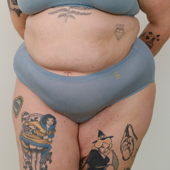 Sustainable mineral blue high waist brief by Underwear for Humanity: ethical, sustainable. sizes 6-26. light, breathable. Models wear high-waisted underwear. underwear sits high on the waist, full seat coverage. smooth under clothing. made from Tencel and recycled materials