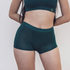 Sustainable, ethically produced atlantis shorts by Underwear for Humanity. Mid-rise, full coverage seat, thin, no-dig, elastic waist, short length sits higher on the leg. Made from sustainable tencel and recycled elastic. Models wear the shorts.