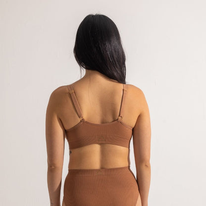 Sustainable, ethically produced nude 4 - tan olive skin tone wireless bra by Underwear for Humanity. A -D cup sizes. Recycled materials, flexible, supportive. Knitted bra and band, adjustable straps. Models wear the A-D bra.