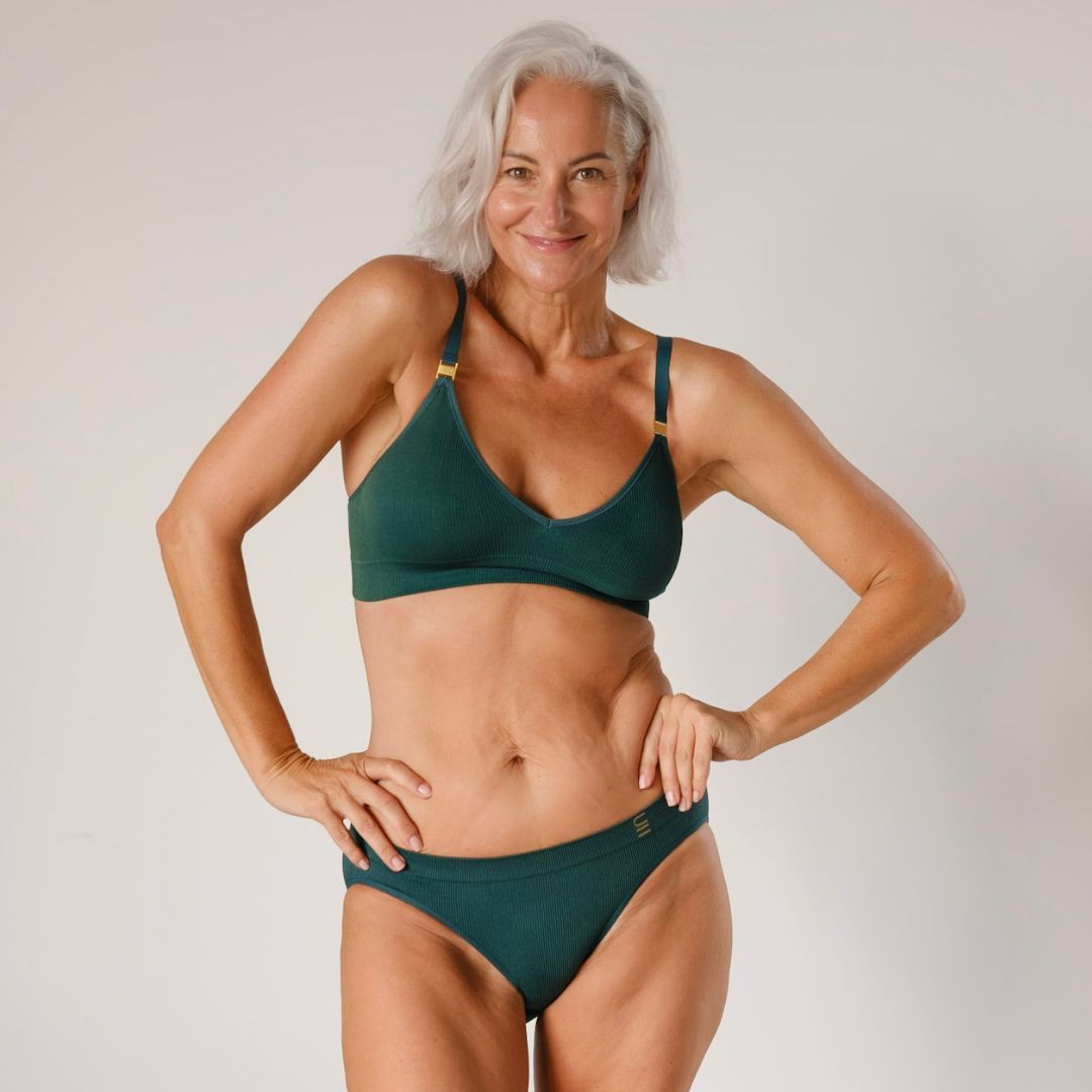 Ethically made recycled seam free atlantis bikini brief by Underwear for Humanity: Flexible and comfortable, stretches across sizes. Models wear bikini brief underwear. Underwear is made from recycled nylon and sits low on the waist, full seat coverage and smooth on the body.