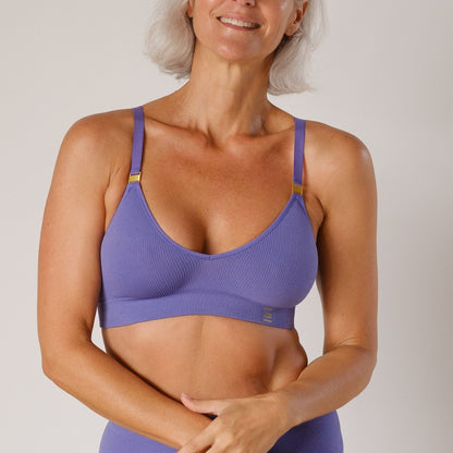 Sustainable, ethically produced light Purple wireless bra by Underwear for Humanity. A -D cup sizes. Recycled materials, flexible, supportive. Knitted bra and band, adjustable straps. Models wear the A-D bra.