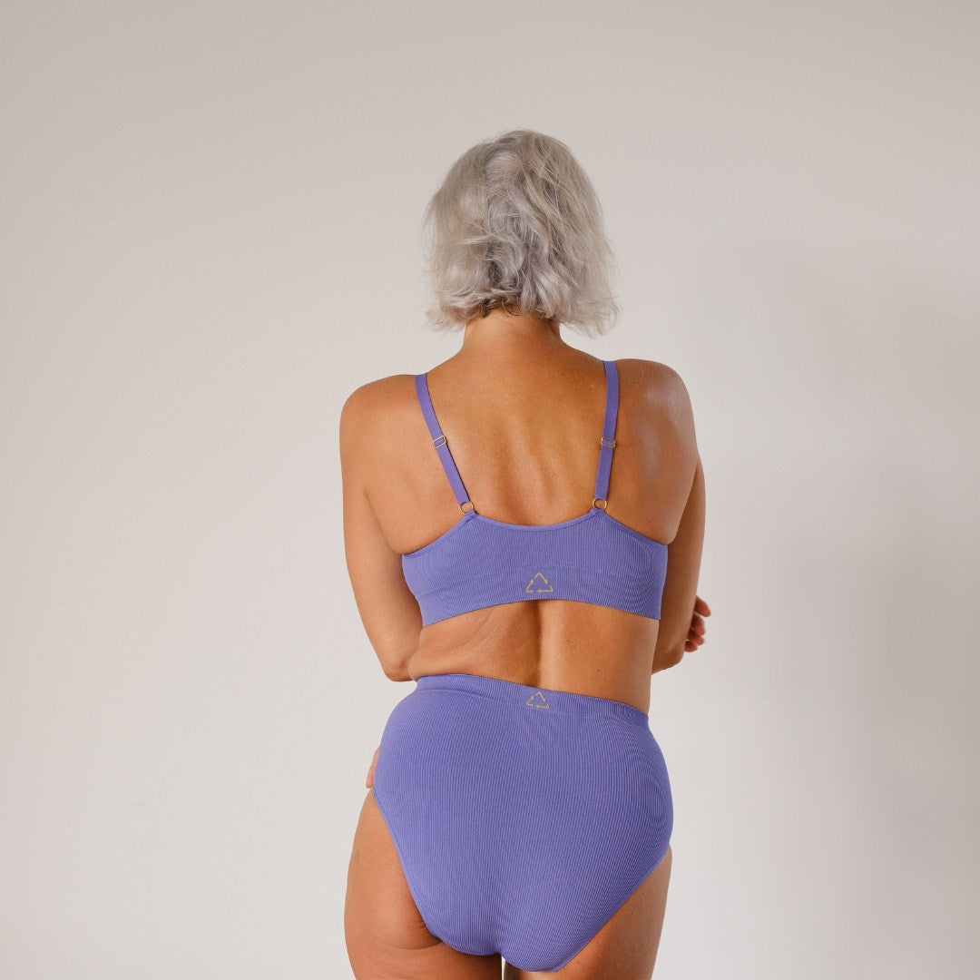 Sustainable, ethically produced light Purple wireless bra by Underwear for Humanity. A -D cup sizes. Recycled materials, flexible, supportive. Knitted bra and band, adjustable straps. Models wear the A-D bra.