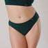 Ethically made recycled seam free atlantis bikini brief by Underwear for Humanity: Flexible and comfortable, stretches across sizes. Models wear bikini brief underwear. Underwear is made from recycled nylon and sits low on the waist, full seat coverage and smooth on the body.