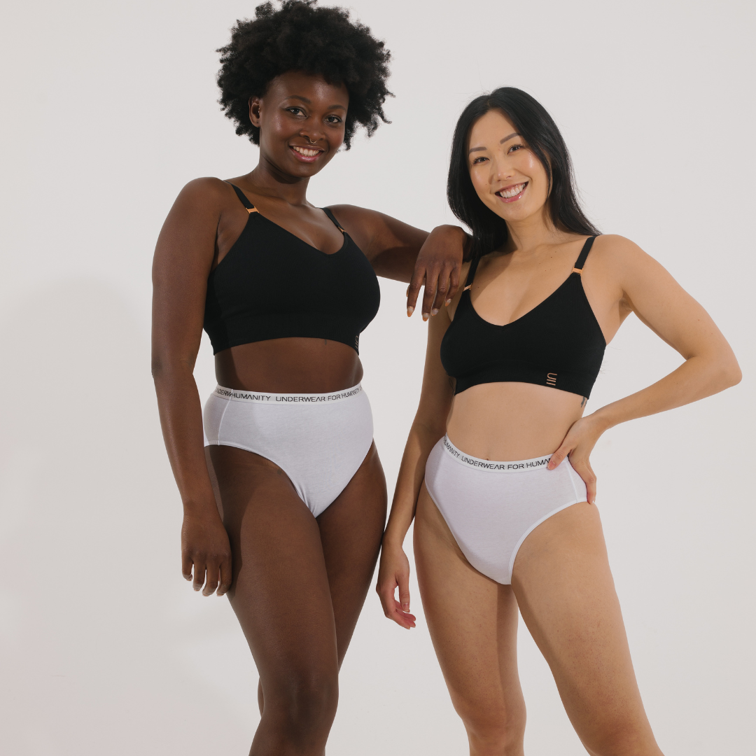 Underwear for Humanity, sustainable, organic and ethically made white cotton underwear. Soft , breathable, full coverage, sits high on waist. Models wear High waisted Cotton underwear in white with a white, recycled nylon elastic waist band.