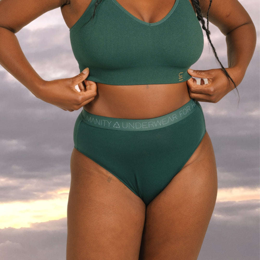 Sustainable atlantis high waist brief by Underwear for Humanity: ethical, sustainable. sizes 6-30 light, breathable. Models wear high-waisted underwear. underwear sits high on the waist, full seat coverage. smooth under clothing. made from Tencel and recycled materials, attached no-dig recycled elastic waist band.