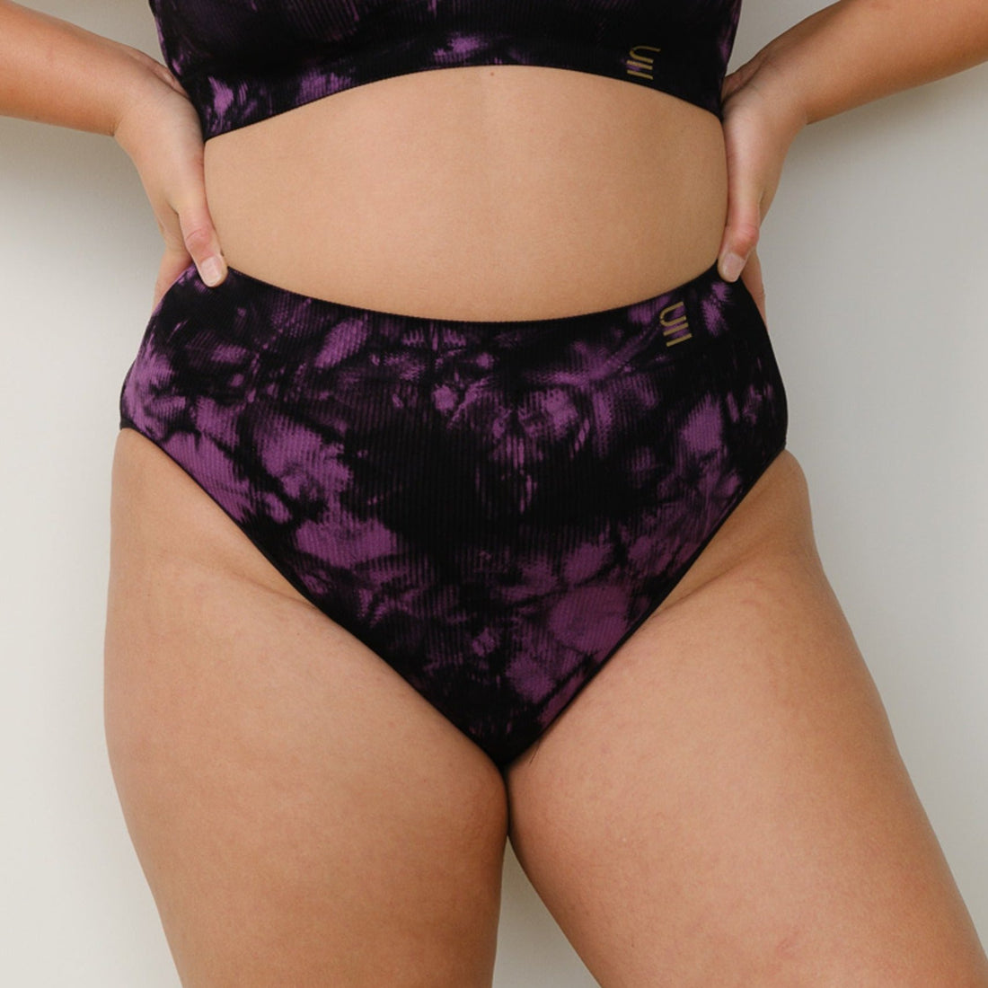 Sustainable, ethically made Tie Dye high waist seam free brief by Underwear for Humanity: Flexible and comfortable, stretches across sizes. Models wear high waisted ethical underwear. Underwear is made from recycled nylon and sits high on the waist, full seat coverage and smooth on the body.