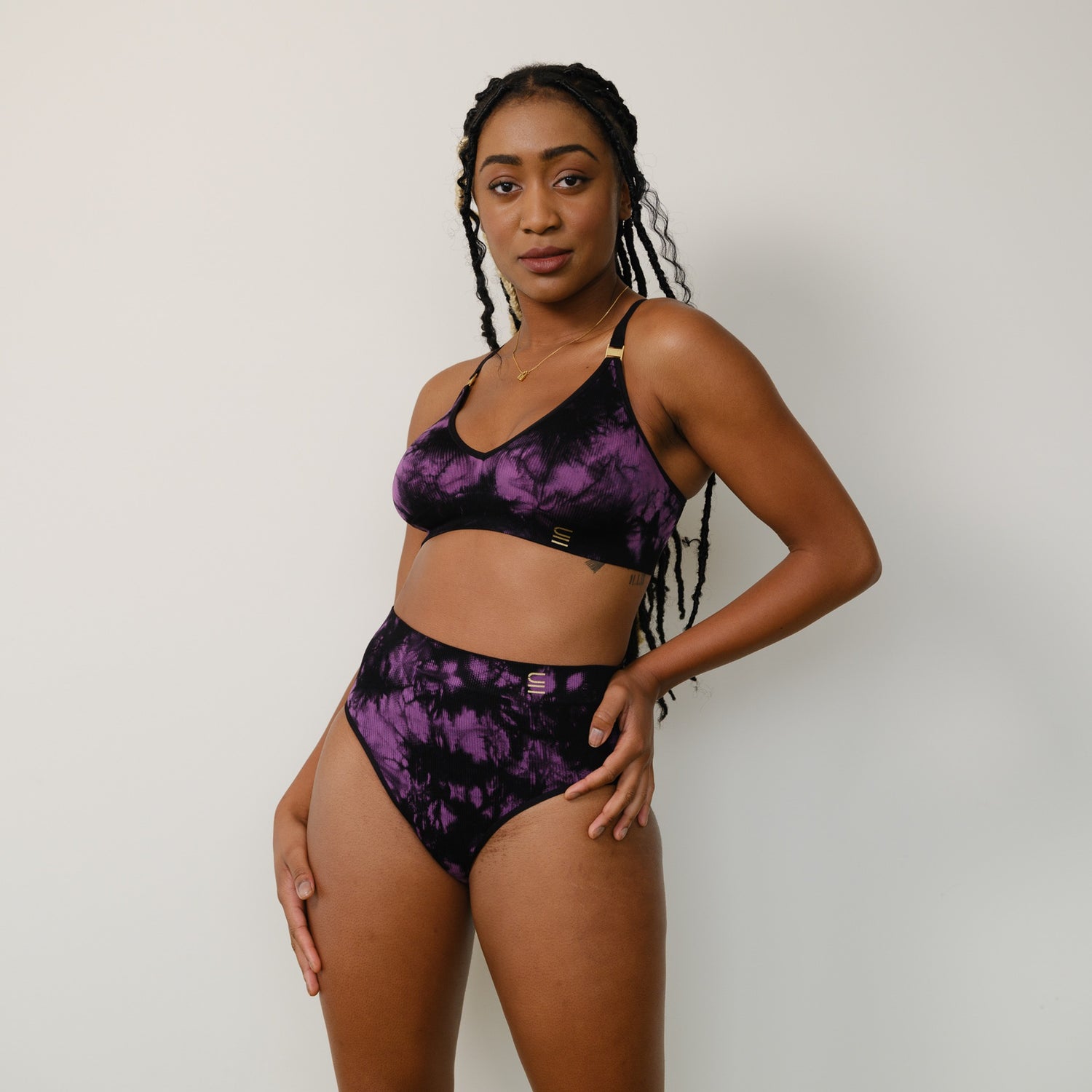 Sustainable, ethically made Tie Dye high waist seam free brief by Underwear for Humanity: Flexible and comfortable, stretches across sizes. Models wear high waisted ethical underwear. Underwear is made from recycled nylon and sits high on the waist, full seat coverage and smooth on the body.