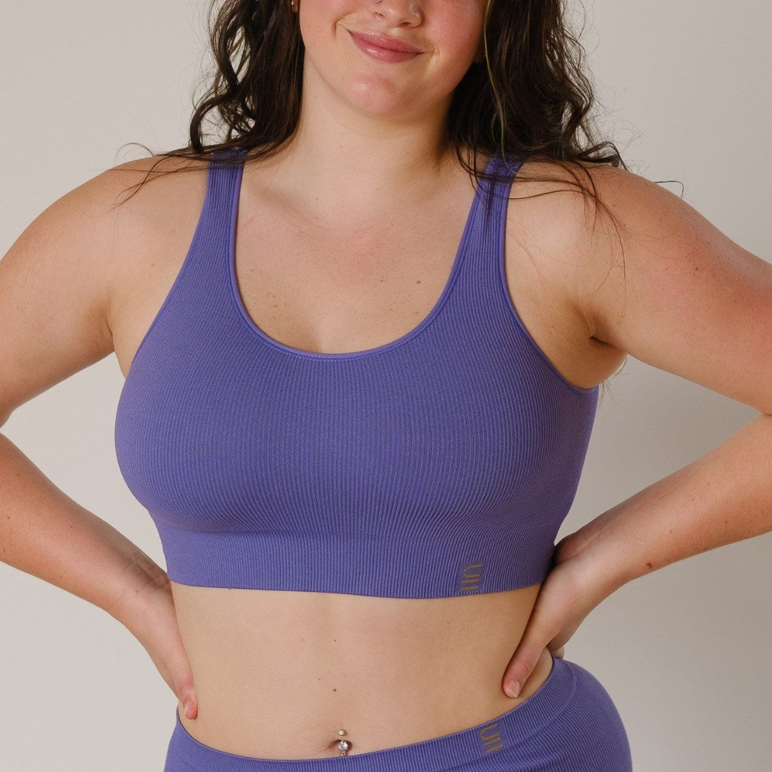 Sustainable, ethically produced light purple bra crop by Underwear for Humanity: stronger support for larger bust, D - GG cup sizes. Recycled materials, knitted bra and band, seamfree, made from recycled nylon. Models wear the D+ Crop