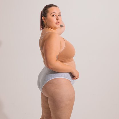 Underwear for Humanity, sustainable, organic and ethically made grey marle cotton underwear. Soft , breathable, full coverage, sits high on waist. Model wears High waisted Cotton underwear in black with a grey marle, recycled nylon elastic waist band.