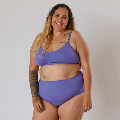 Sustainable, ethically made light purple high waist seam free high waist brief by Underwear for Humanity: Flexible and comfortable, stretches across sizes. Models wear high waisted brief underwear. Underwear is made from recycled nylon and sits high on the waist, full seat coverage and smooth on the body.