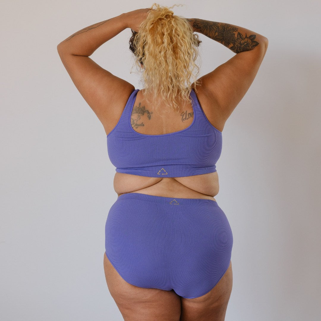 Sustainable, ethically made light purple high waist seam free high waist brief by Underwear for Humanity: Flexible and comfortable, stretches across sizes. Models wear high waisted brief underwear. Underwear is made from recycled nylon and sits high on the waist, full seat coverage and smooth on the body.