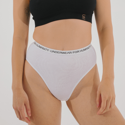 Underwear for Humanity, sustainable, organic and ethically made white cotton underwear.  Soft , breathable, full coverage, sits high on waist. Model wears High waisted Cotton underwear in white with a white, recycled nylon elastic waist band.  