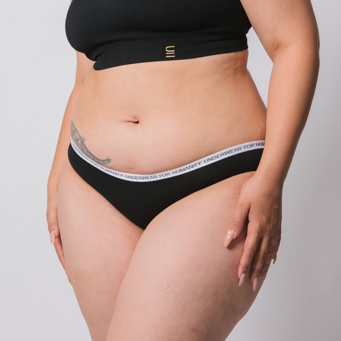 Organic cotton bikini briefs in black – eco-friendly and sustainable underwear.