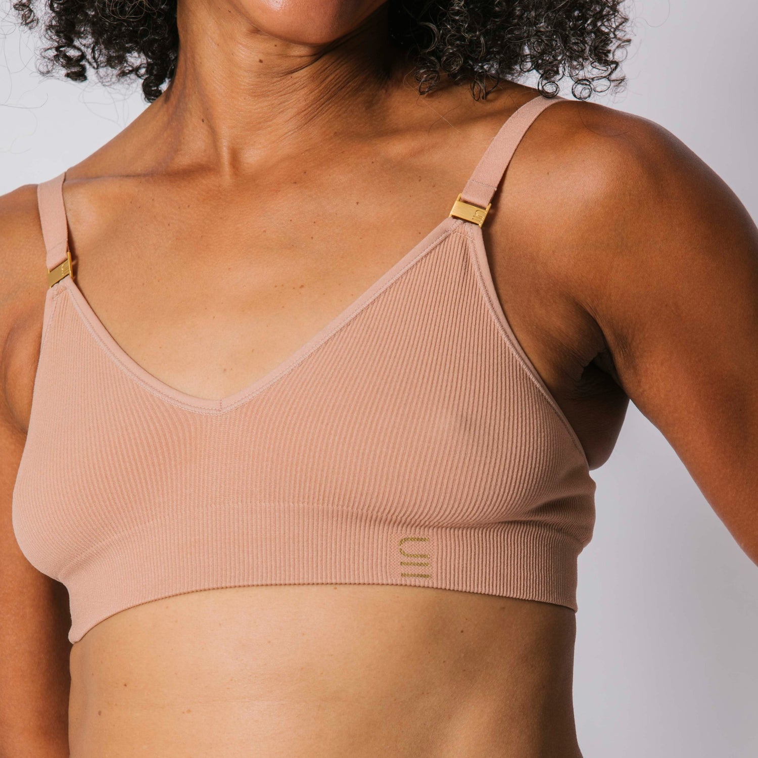 Sustainable, ethically produced Nude 3- light beige skin tone wireless bra by Underwear for Humanity. A -D cup sizes. Recycled materials, flexible, supportive. Knitted bra and band, adjustable straps. Models wear the A-D bra.